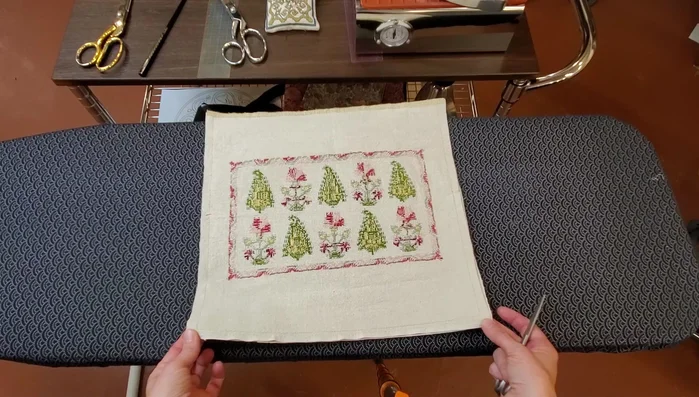 Trim excess fabric at the corners to reduce bulk, being careful not to cut too close to the stitching.