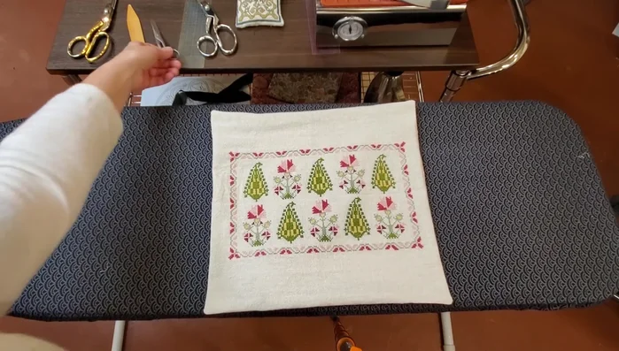 Press the finished cushion cover to ensure the backing is smooth and flat.