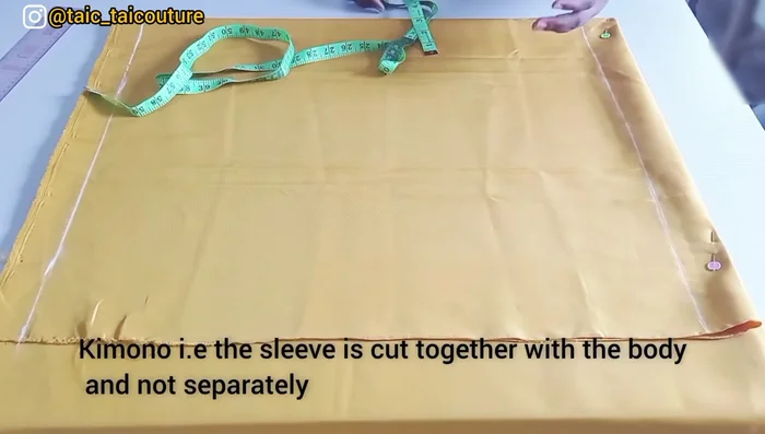 Determine the width. Include shoulder measurement (8 inches), sleeve length (14.5 inches), and sleeve opening (double your elbow measurement, e.g., 12 inches for a total of 24 inches when opened).
