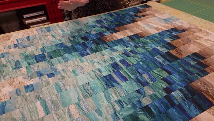 Quilt the finished piece on a quilting machine (optional).