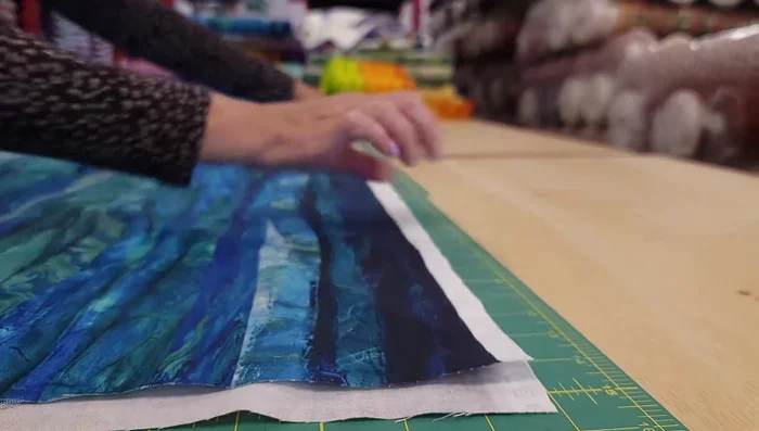 Cut the fabric into strips according to the pattern (3", 2.5", 2", 1.5", 2", repeating).