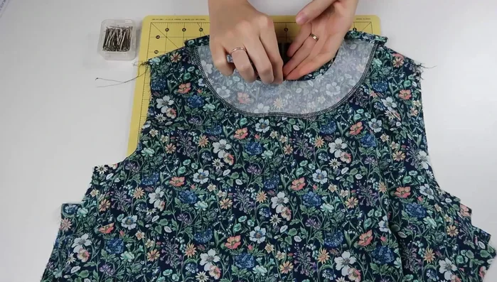 Insert loop into keyhole opening, pin and stitch closed.