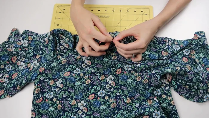 Sew on button and finish hem.