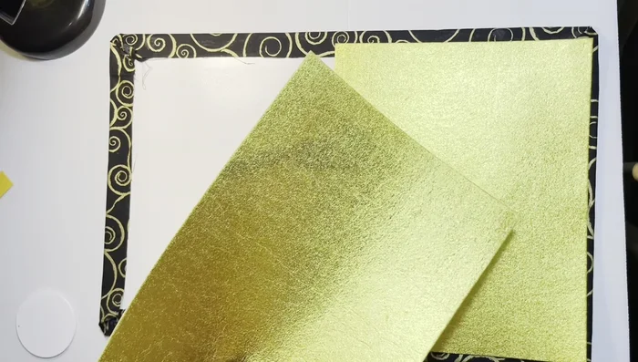 Glue and Fold Felt: Glue the felt lining to the inside of the clutch, ensuring a smooth and even finish. Fold and glue the edges of the felt to secure the lining.