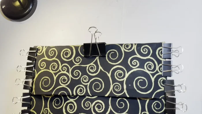 Add Velcro Closure: Attach velcro pieces to the clutch to create a secure closure.