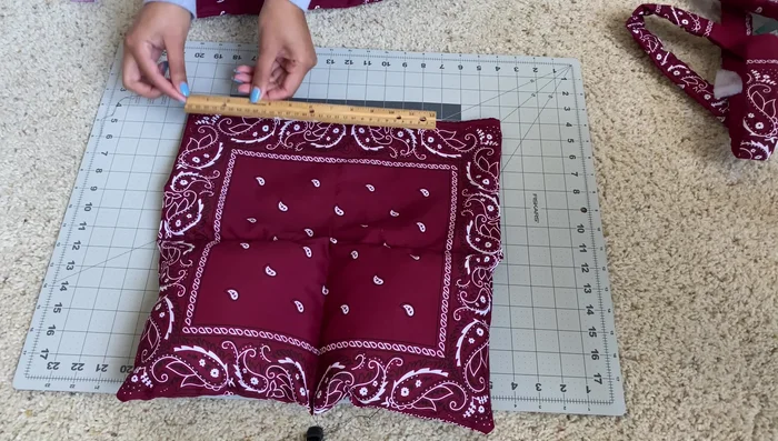 Sew across the top of the straps, attaching them to the bag.