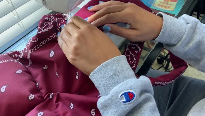 Sew across the top of the straps, attaching them to the bag.