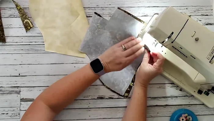 Create boxed corners at the bottom of the basket by matching and stitching the seams at a quarter-inch seam allowance.