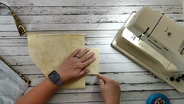 Create boxed corners at the bottom of the basket by matching and stitching the seams at a quarter-inch seam allowance.