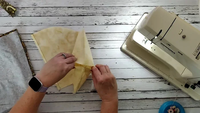 Create boxed corners at the bottom of the basket by matching and stitching the seams at a quarter-inch seam allowance.