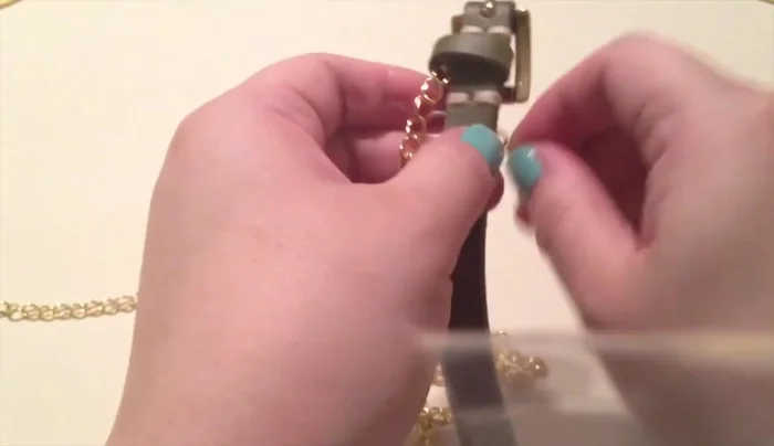 Wrap the chain around the belt, stopping an inch from the belt hole. Use a jump ring to close the two ends together.