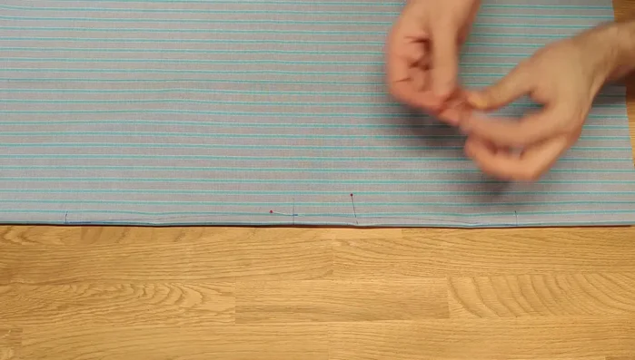 Secure both sides of the dart with pins. Ensure all stripes remain parallel. 