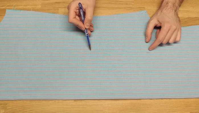 Transfer the dart length from your initial shirt pattern or divide the dart's new length in half to find the middle.