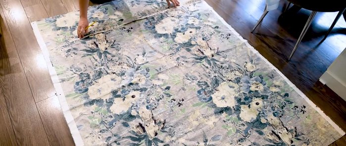 Press and sew 1-inch hems on the sides and bottom of the fabric, leaving the bottom hem open for dowel insertion.