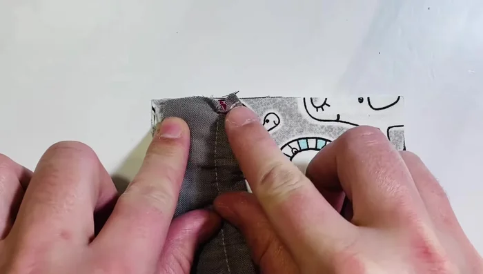 Attach heel to toe: Lay heel (right side down) to the top left corner of the toe piece, matching edges. Sandwich with lining toe piece (right side down). Pin/clip all layers together. Repeat for the other side.