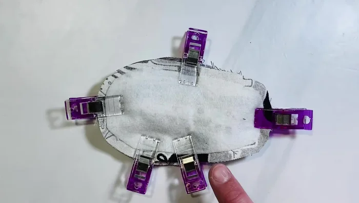 Sew the sole: Sew all the way around the bottom, leaving a 1.5-inch gap on the inner left side. Clip notches around curves to prevent puckering when turning right side out.