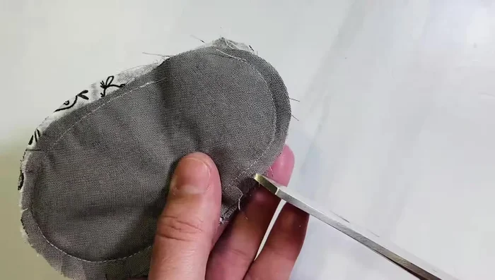 Turn right side out: Turn the shoe right side out through the gap, being careful to push out all the seams. Close the gap with a stitch, and secure with a zigzag stitch to prevent fraying.