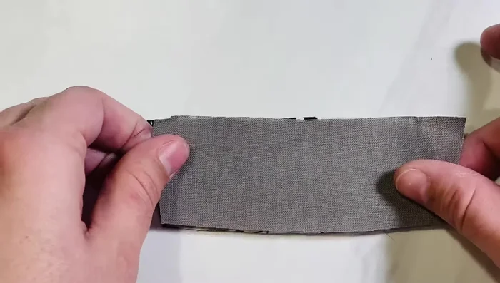 Create the heel: Lay lining and outer fabric right sides together. Sew across the longest side (1/4 inch seam allowance). Open, fold with seam at top, and press if needed.