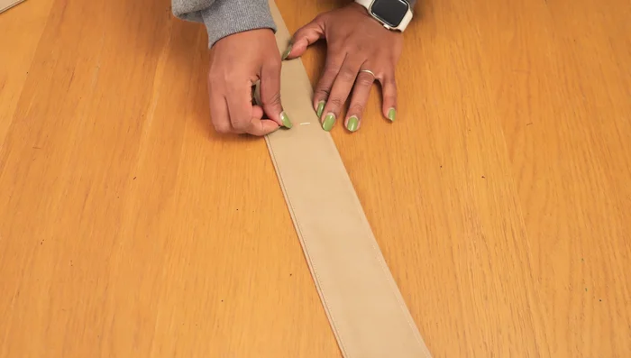 Add more eyelets: Repeat the eyelet insertion process for the additional marked positions.