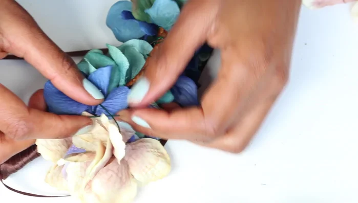 Use extra wires to loop around existing wires, building up height and creating a rounded shape.