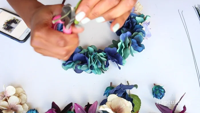 Attach leaves and petals without pre-existing holes by pushing the wire through the fabric.