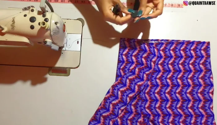 Cut a notch at the top and bottom of the elastic on both sides.