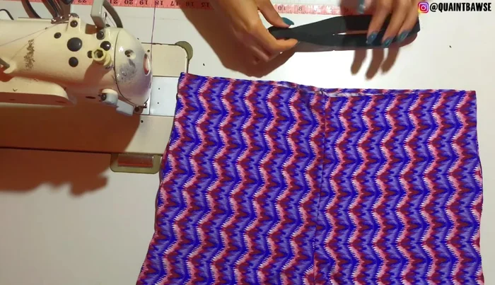 Cut a notch at the top and bottom of the elastic on both sides.