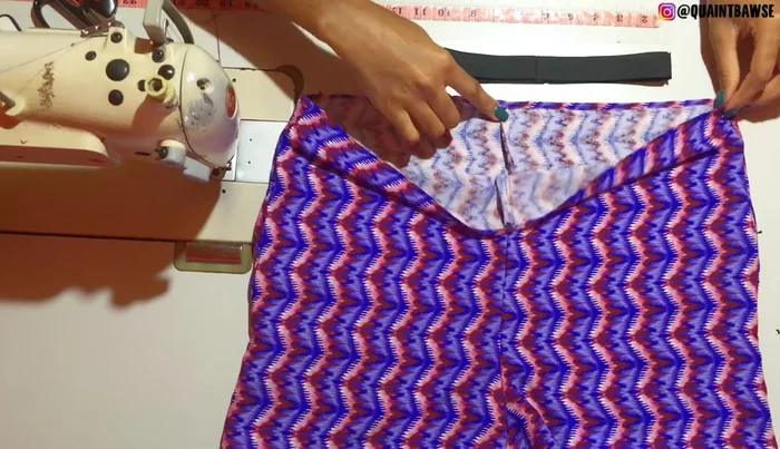 Pin the elastic to the garment, ensuring even distribution.