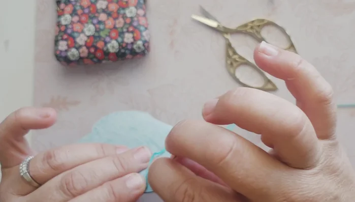 Continue stitching along the edge, creating a solid stitch.