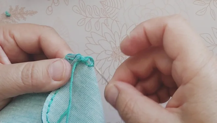 Turn the purse inside out carefully using a blunt object to help push out the corners.