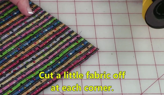 Trim the corners to about 1/8 inch to reduce bulk.