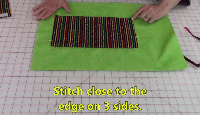 Stitch the pocket to the lining, securing all edges.