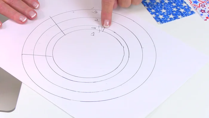 Arrange Strips: Determine the pattern on the wreath form. Each section takes about 40 strips. Use a combination of fabrics to create your design (e.g., patriotic theme).