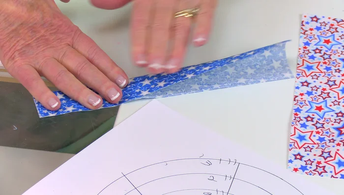 Continue Attaching: Repeat the process, creating a pattern or design by alternating colors and adjusting the number of strips per row. Work your way from the outer ring to the center.