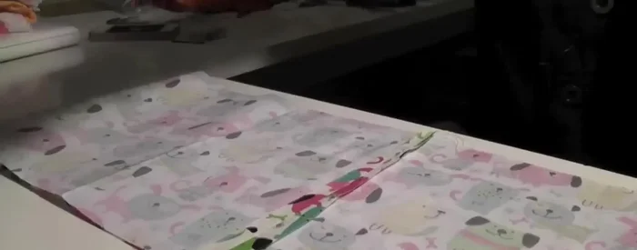 Pin the hem of the sewn hoop to the hem of the shirt.