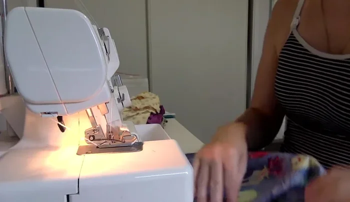 Sew main fabric pieces: Sew the side seams of the main fabric pieces (1cm/3/8 inch seam allowance) and overlock the seams immediately.