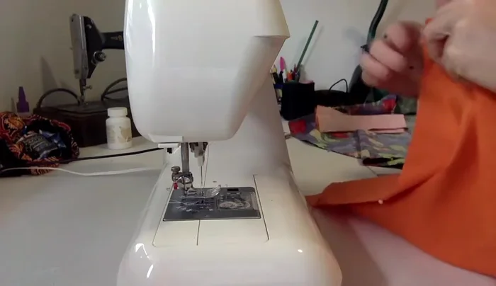 Overlock lining seams: Overlock the side seams of the lining.
