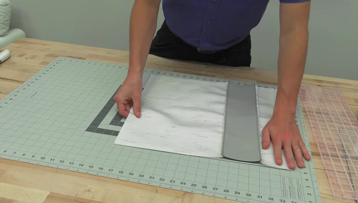 Reduce bulk at the corners by cutting a small wedge from each corner (about a half-inch from the corner, extending diagonally 4.5 inches across the panel).