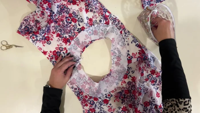 Tack down facing at shoulder seams: Stitch the facing down at the shoulder seams.