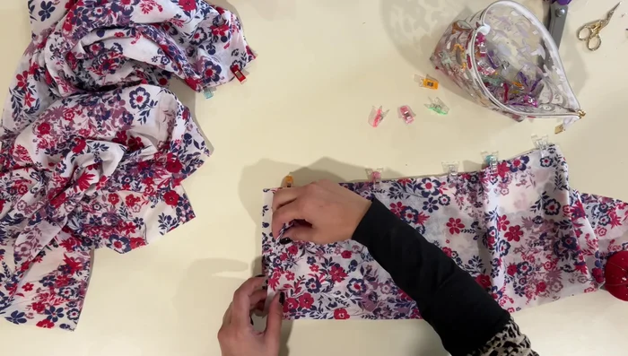 Insert sleeves: Insert sleeves into armholes, matching seams and gathering the top of the sleeves to fit.