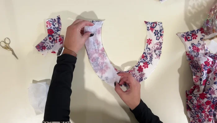 Finish raw edges of facing: Serge or zigzag stitch the raw edges of the facing.