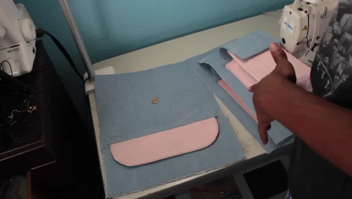 Construct the front flap pocket, adding a similar panel piece for a cleaner finish.