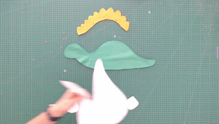 Embroider eyes on both sides using 6 strands of embroidery floss and backstitches.