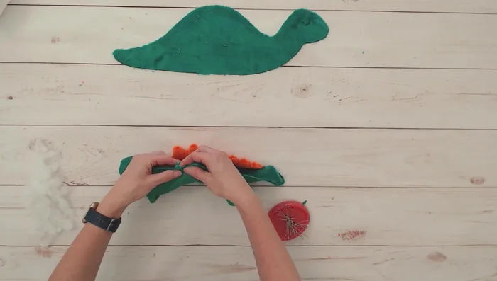 Baste legs into position, aligning with pattern markings. Use pins to hold them.