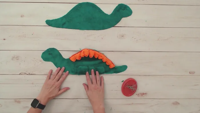 Sew the two body pieces together, right sides together, leaving a gap for turning. Tuck legs and spikes inwards. Use plenty of pins.