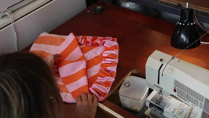 Pin the remaining pillow pieces together, and sew a half inch from the edge. Sew around the pillow, carefully maneuvering around the zipper.