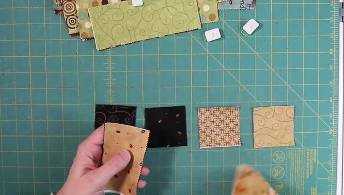 Sew the strip sets: Lay out the strip sets, alternating dark and light. Sew the strip sets together, ensuring seams are perpendicular and iron well after each seam.