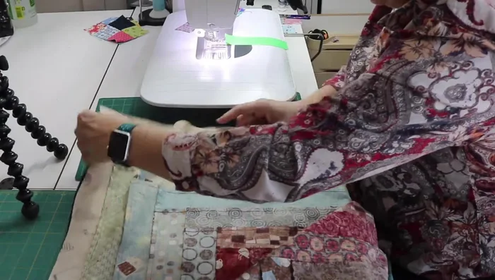 Assemble the quilt blocks: Sew the pairs of blocks together (dark/light, light/dark). Press seams to the darker side. Line up the long sides of the blocks, nesting the middle seams, pin, and sew.