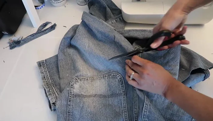 Cut off the inside of the front pockets and use them as flaps for the back pockets.