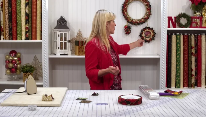 Layer Fabric Squares: Arrange and pin the fabric squares onto the wreath, starting with a base color (e.g., cream). Use a criss-cross pattern in the center for efficiency, then work outwards, placing squares approximately 1/8 inch apart for optimal density. Alternating colors is recommended for a visually appealing result.